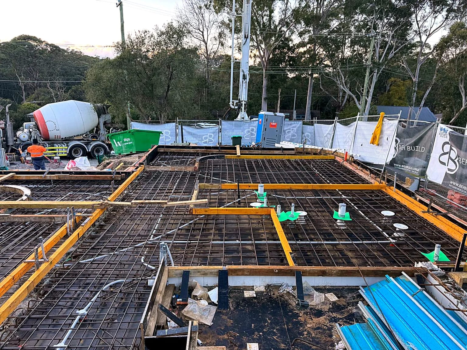 Reinforcement mesh and edge formwork prepared across a concrete deck.