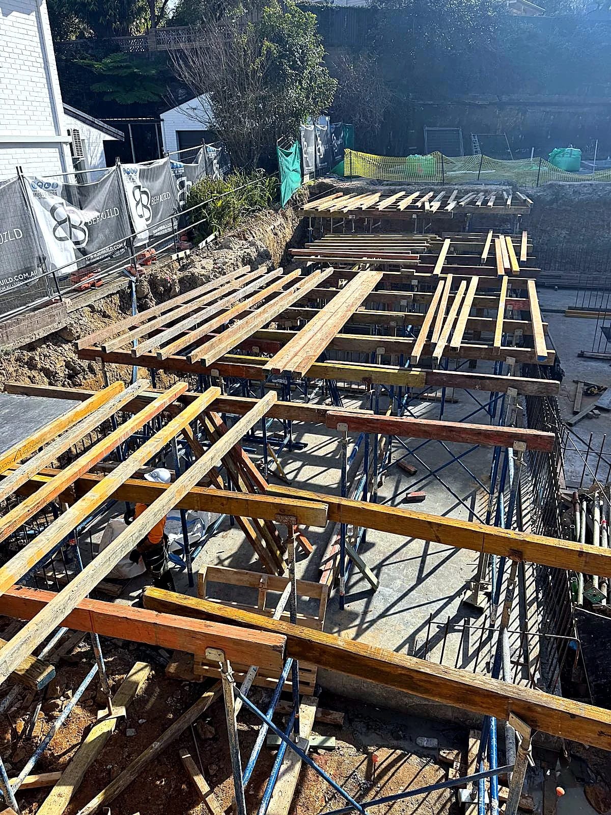 Timber bearers and shoring arranged for suspended slab formwork.