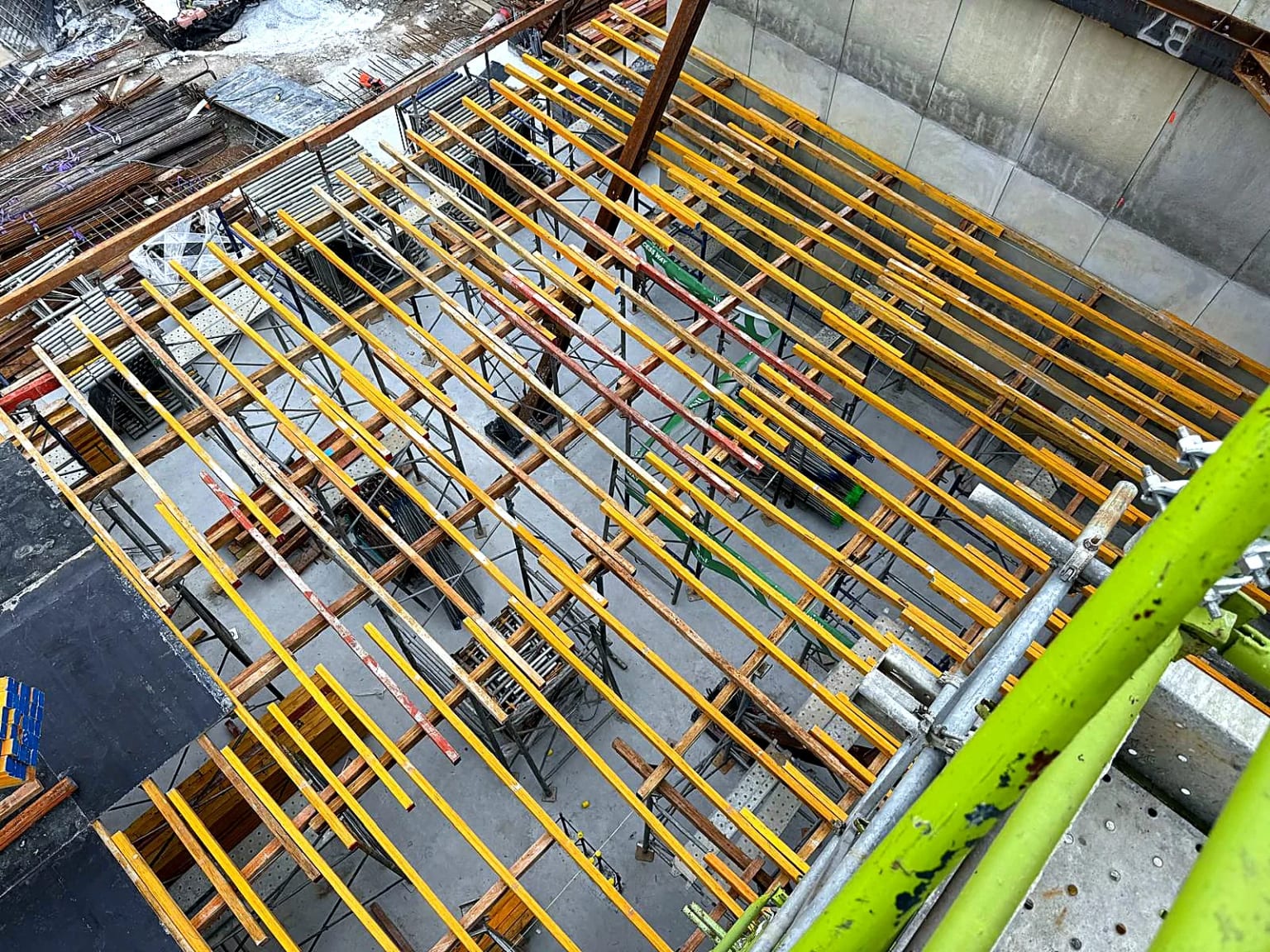 Timber bearers and shoring viewed from above within the basement structure.